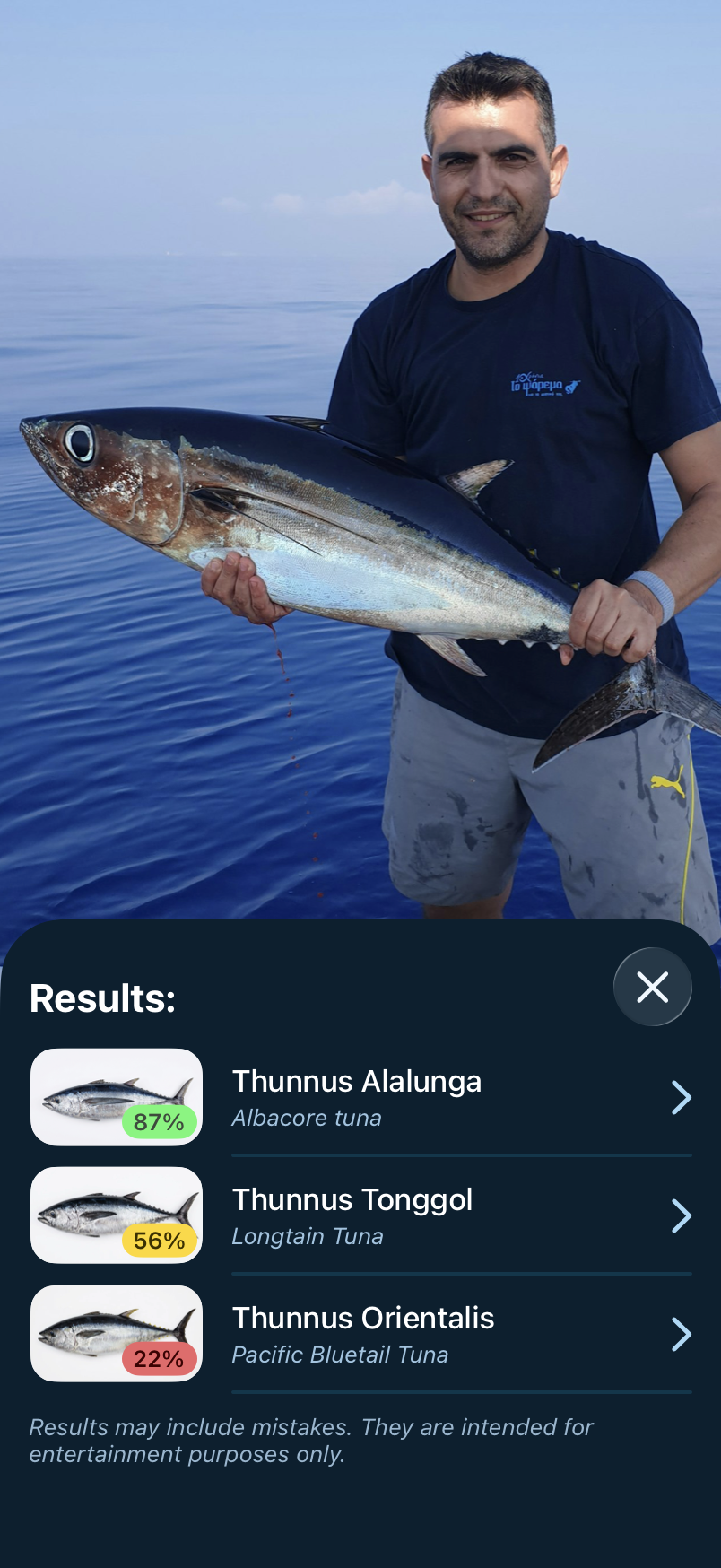 Fish Identify screen in Fishing Calendar App, with Take Photo and Import from Library buttons